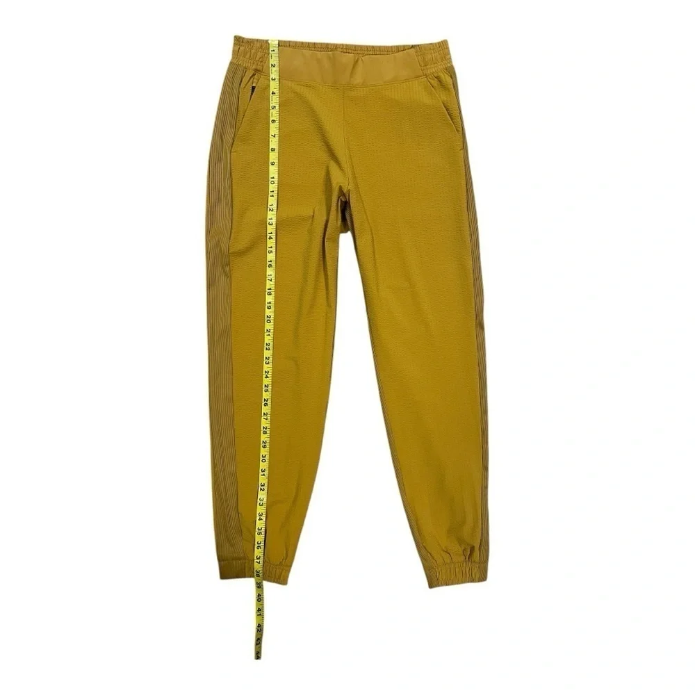 ATHLETA Brooklyn Joggers Women’s  NWOT Size 10 Gold